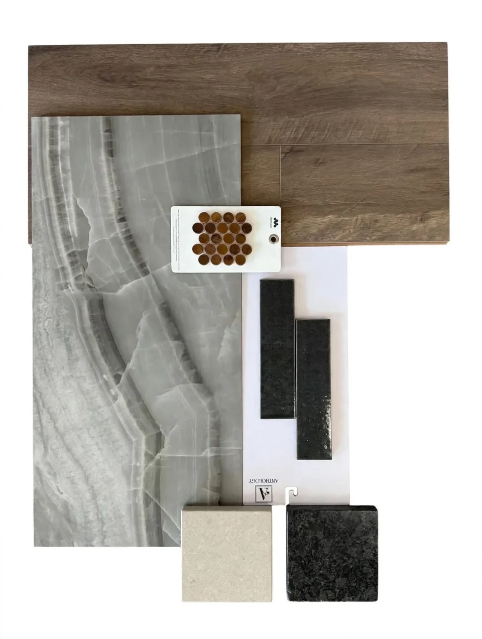 Material selection board with coordinated wood, stone, tile, and finish samples.