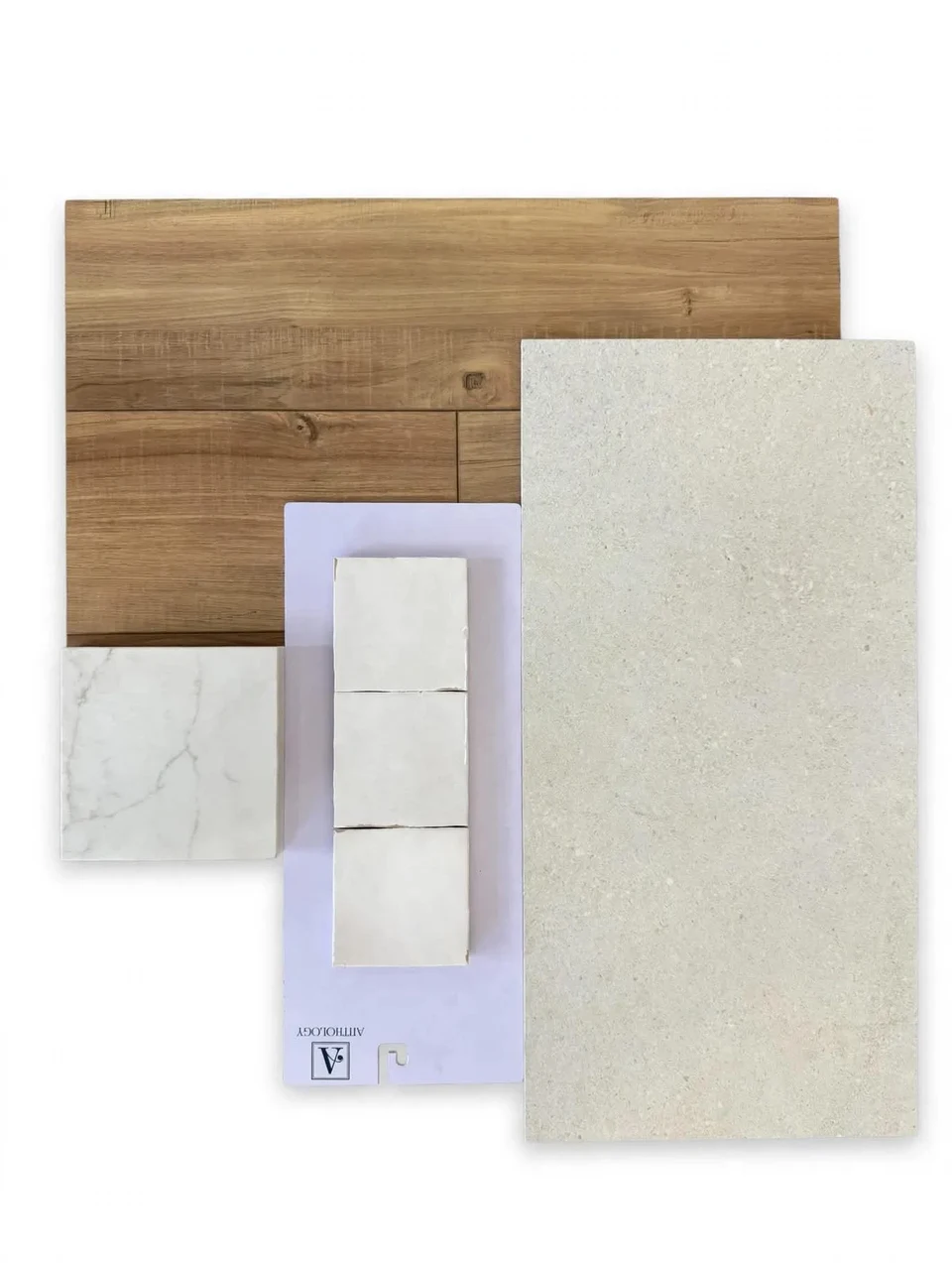 Material selection board with coordinated wood, stone, tile, and finish samples.