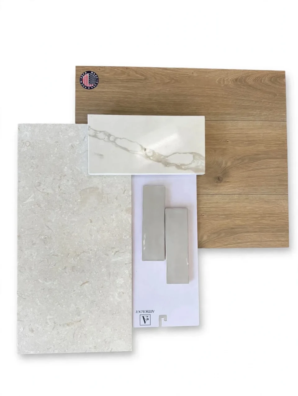 Material selection board with coordinated wood, stone, tile, and finish samples.